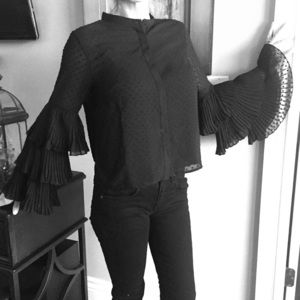 Cute black top with Matador sleeves. NWOT